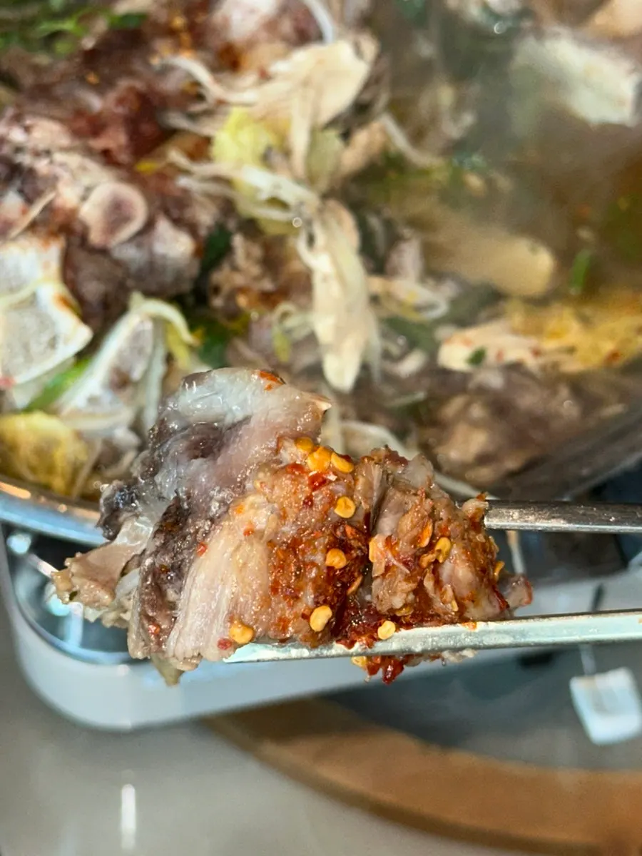 Beef bone hot pot meat topped with kimchi