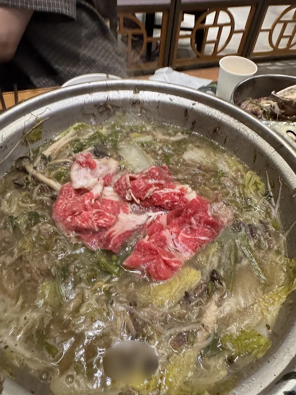 Shabu-shabu beef lightly cooked in the broth