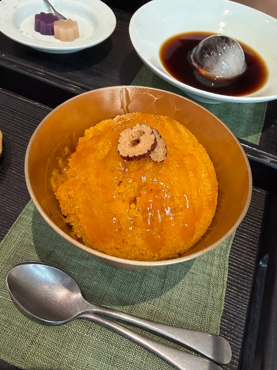 Bibibidang's pumpkin bingsu served in a brassware-style bowl