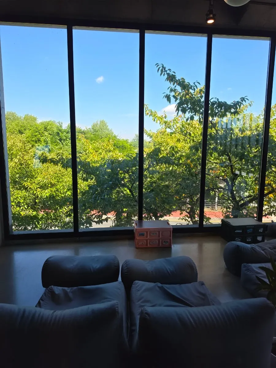 2nd-floor seating with a view through the floor-to-ceiling windows