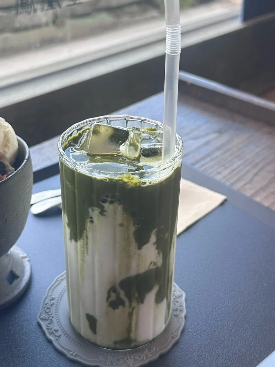 A cold glass of matcha latte