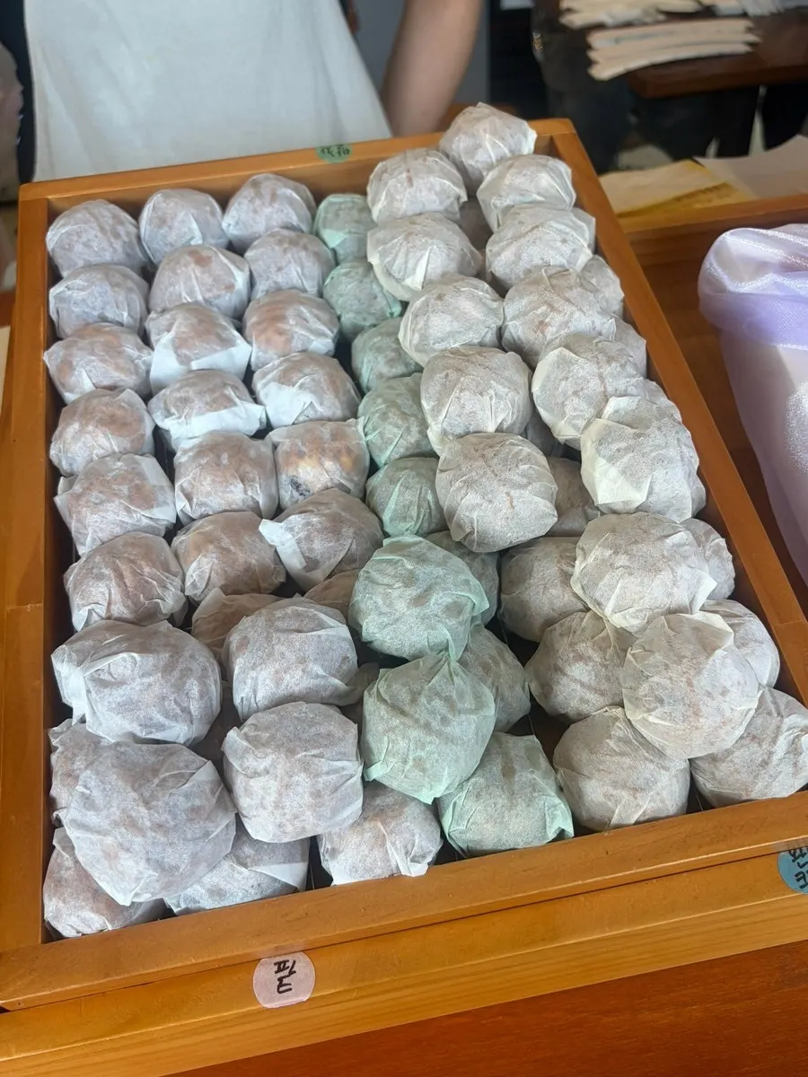Walnut pastries being packed into a box