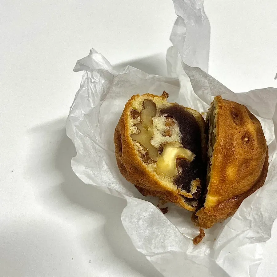 Cross-section of a red bean walnut pastry, cut in half