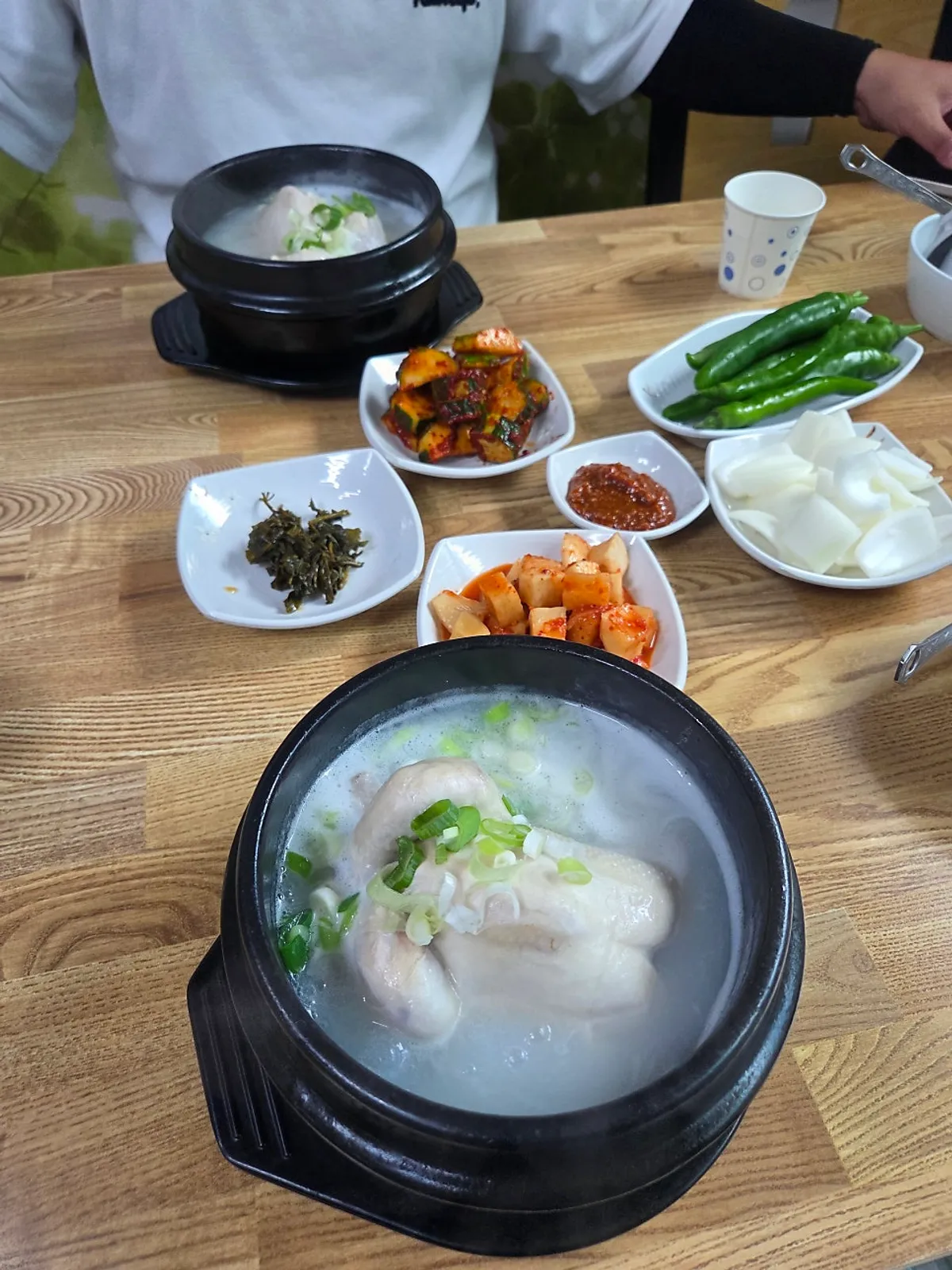 A full table setting of yeongyang samgyetang