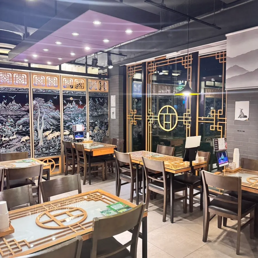 Restaurant dining area with floor-to-ceiling windows