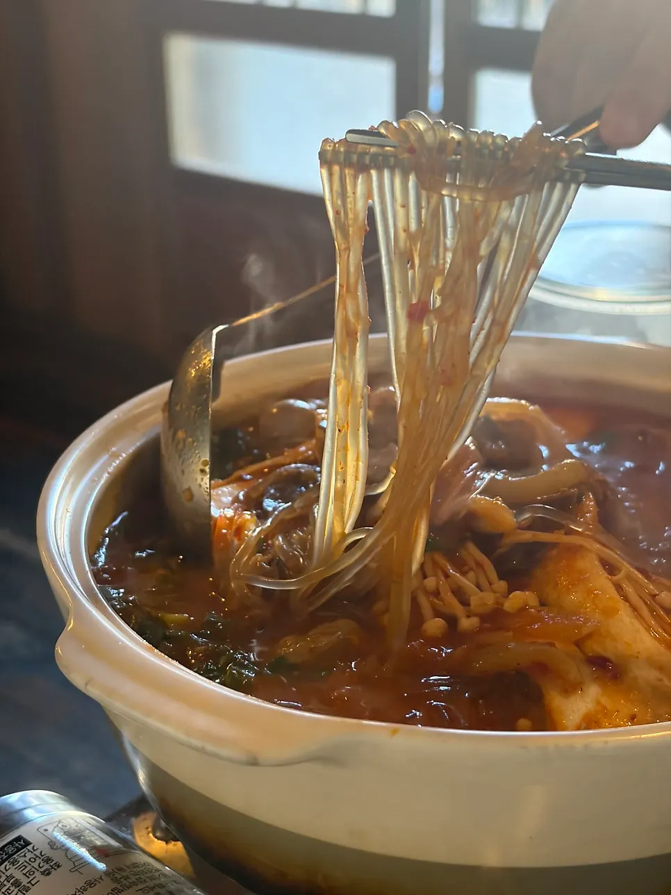 Tripe hot pot broth and ingredients in a bowl