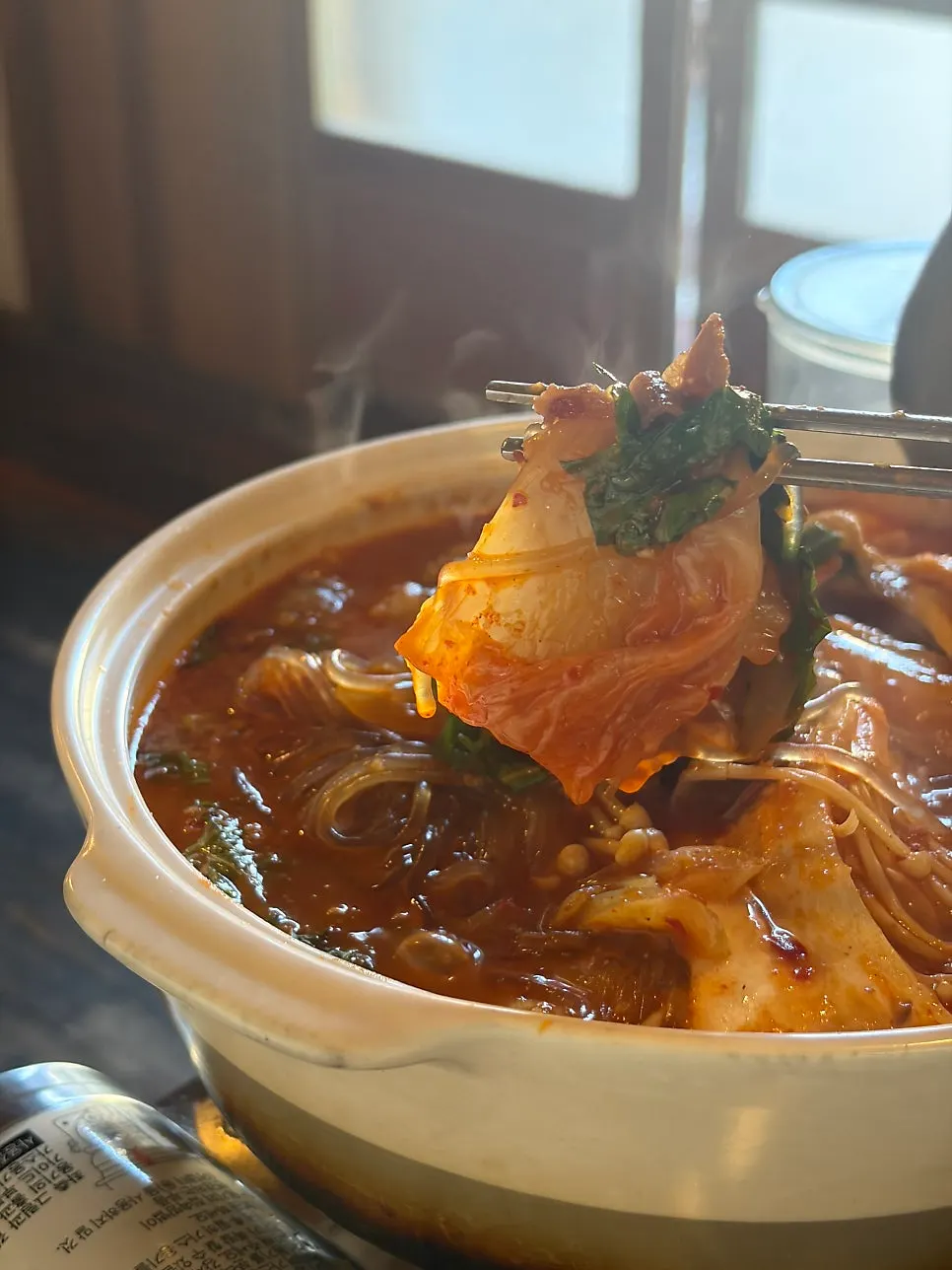 Hot pot with kimchi and meat toppings