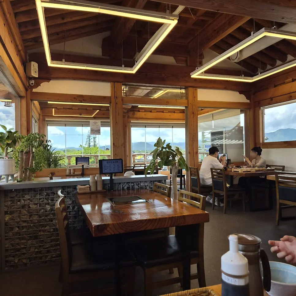 Interior of Handa Sot with hanok-style decor and large windows