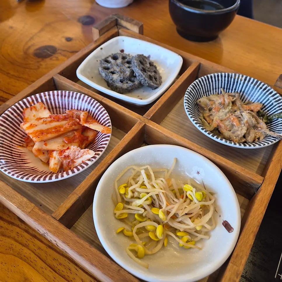 Seating at Handa Sot with a view through the floor-to-ceiling windows