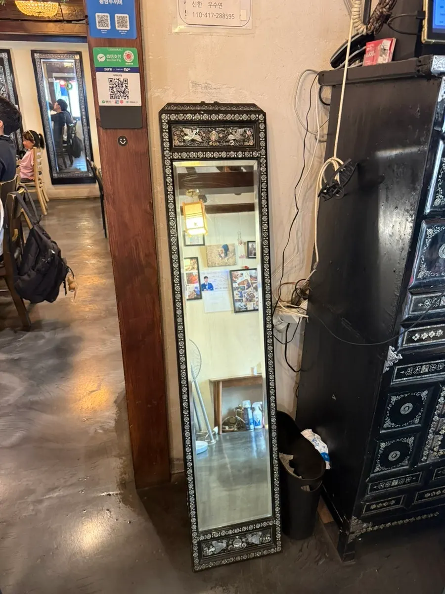 Vertical shot of the dining hall decorated with old furniture