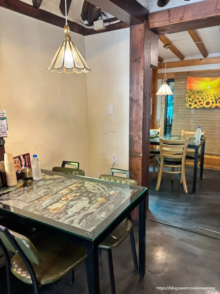 Indoor table seating at Hwangnam Dukkebi Restaurant