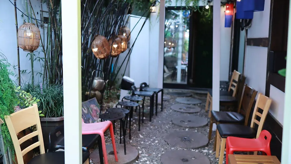 Outdoor seating with a hanok wooden porch feel