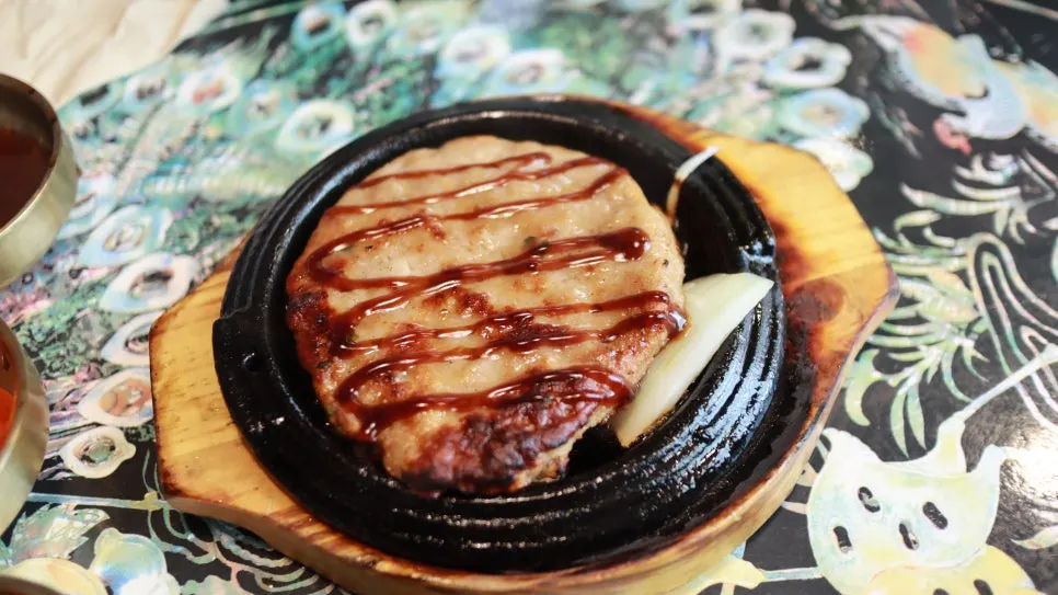 Buckwheat pancake eaten alongside the braised rib