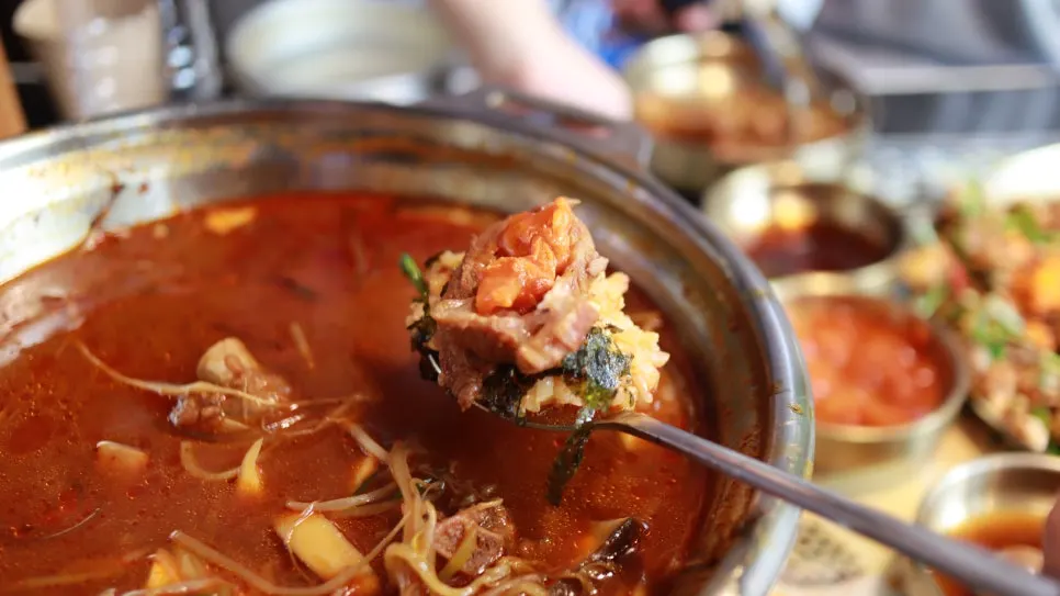 Rice dipped into the rib broth