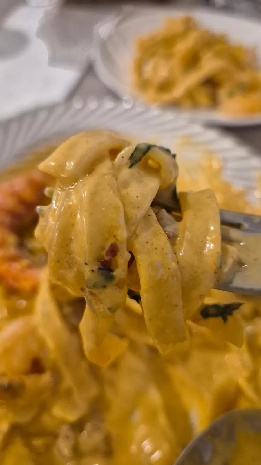Two giant prawns on top of the pasta