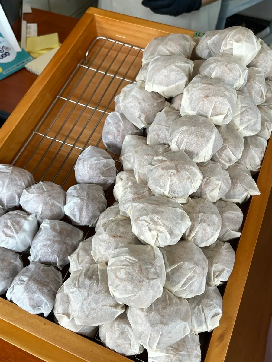 Walnut pastries piled up like a mountain at Buja Hodu