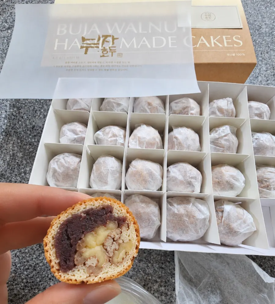 Cross-section of a pastry with red bean and whole walnut
