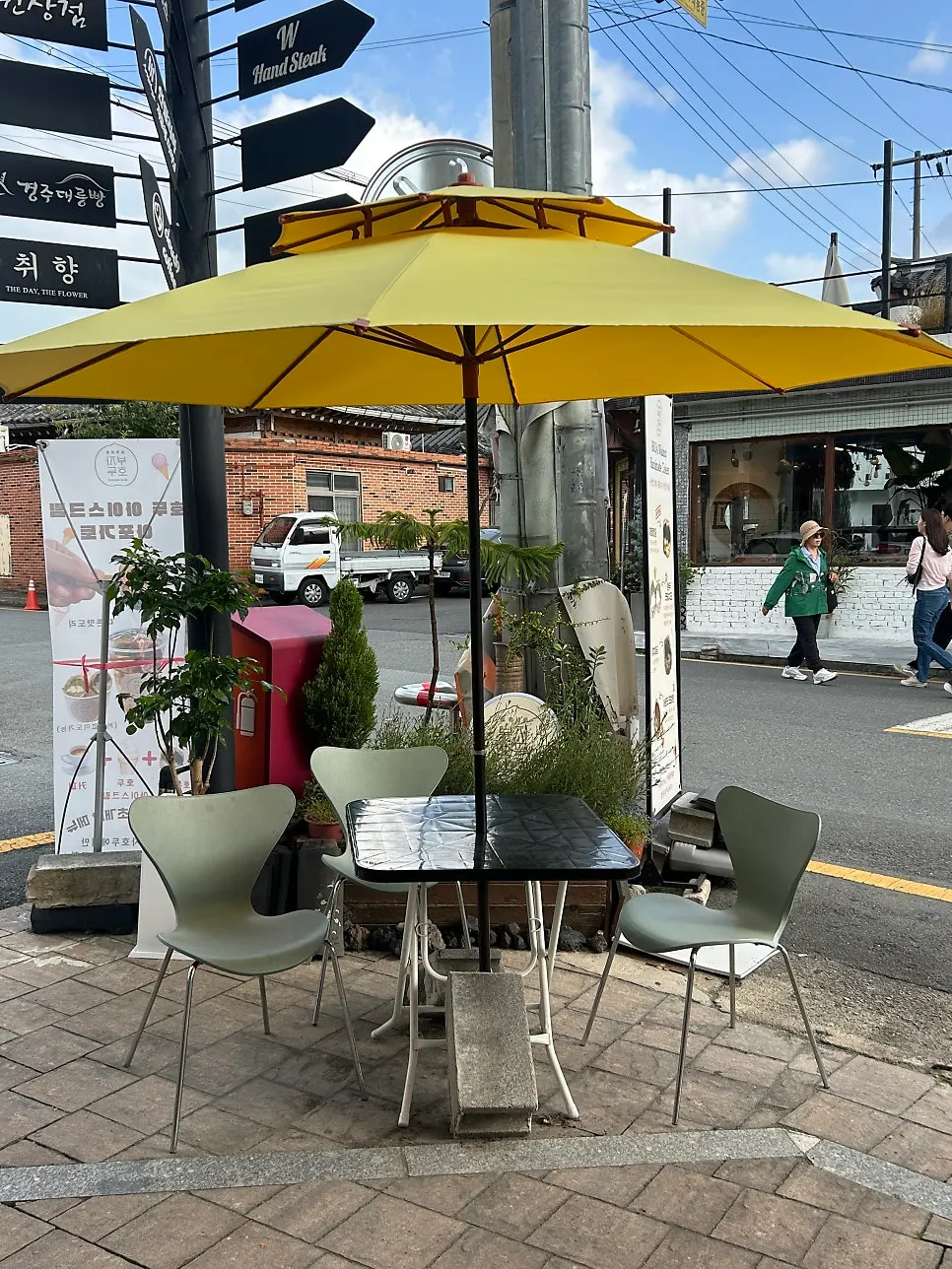 Buja Hodu outdoor terrace with yellow parasols
