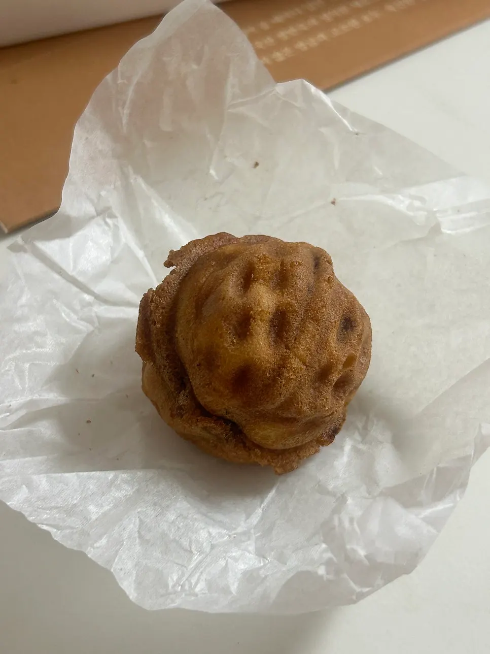 A Buja Hodu walnut pastry with a whole walnut inside