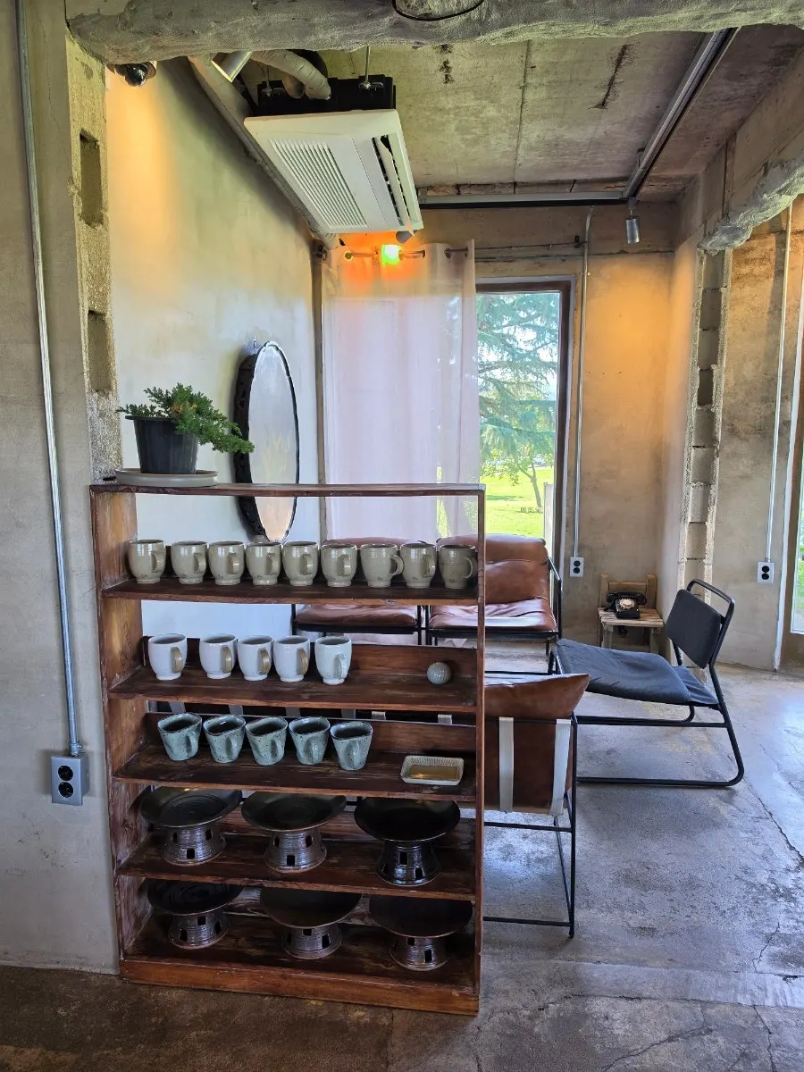 Interior of Cafe Bonghwangdang with traditional relic-style props