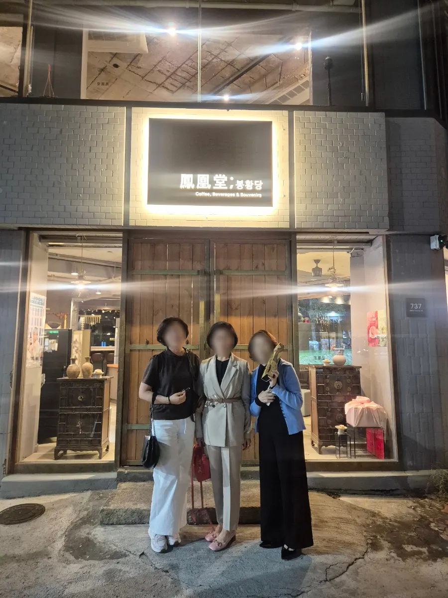 Three sisters laughing by the window at Bonghwangdang
