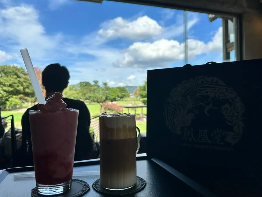 Bonghwang Coffee on the window table with autumn sky in the background