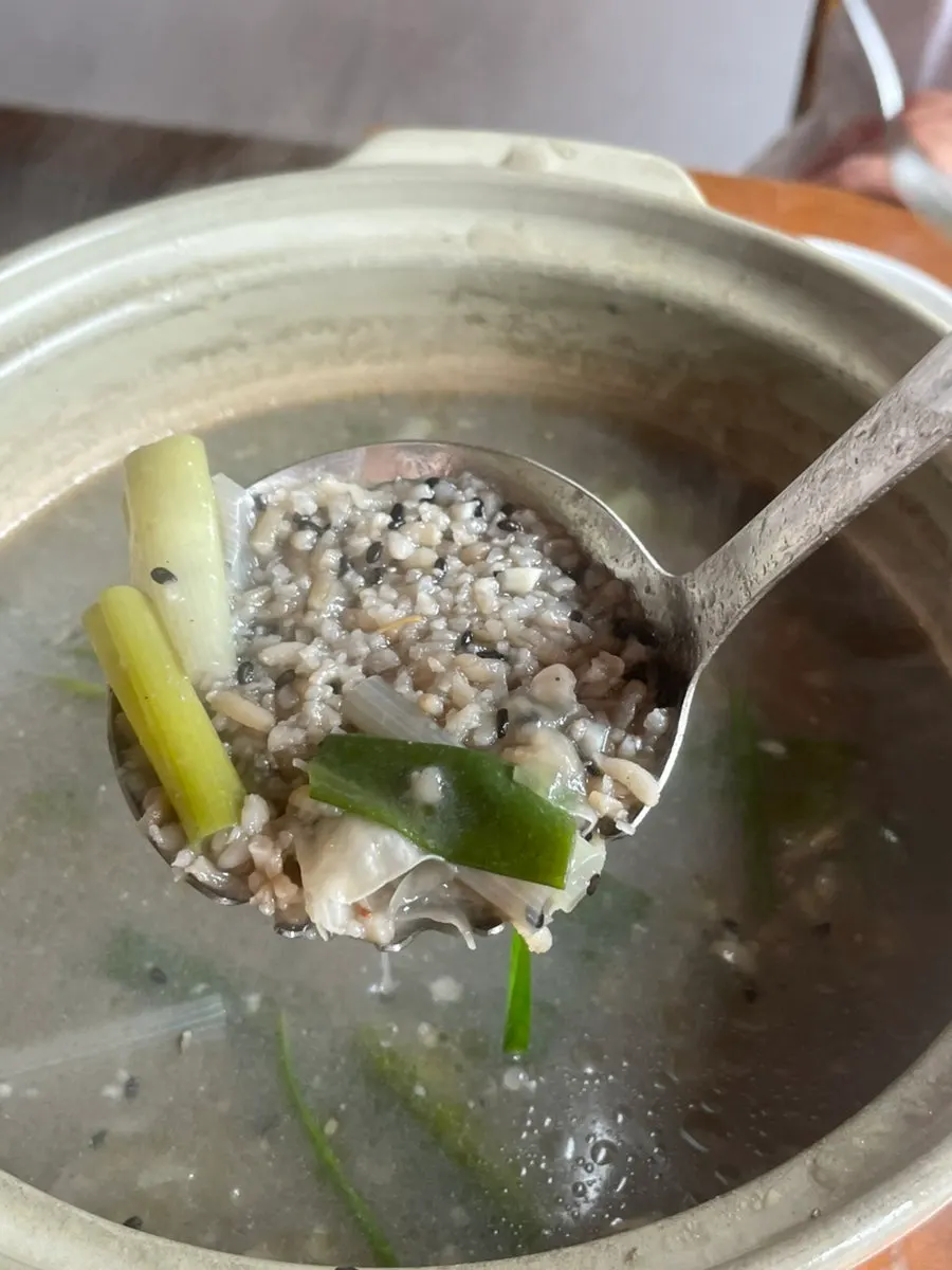 Nutty stew broth with black sesame and rice crust
