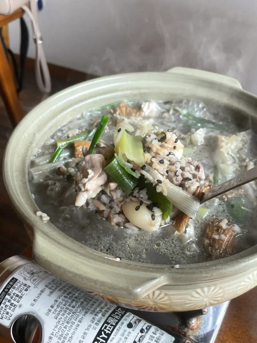 A bowl of chicken stew loaded with mushrooms