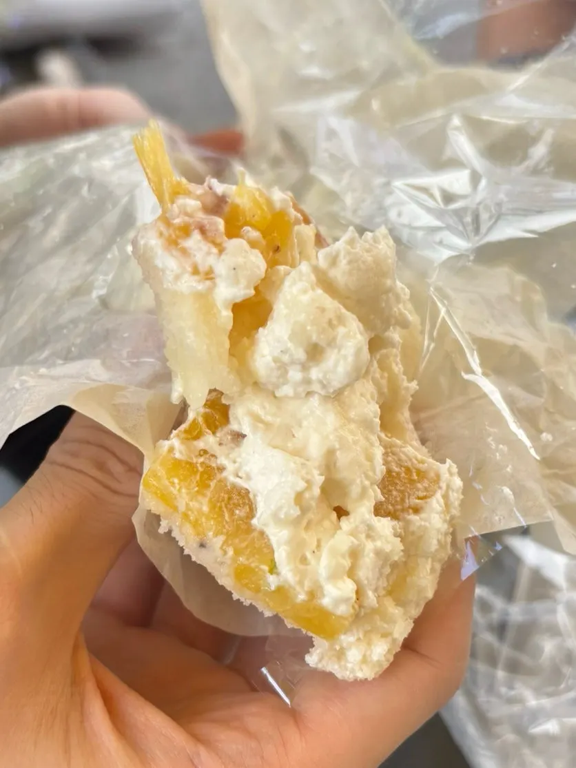 Layers of cream and red bean paste in the pineapple mochi