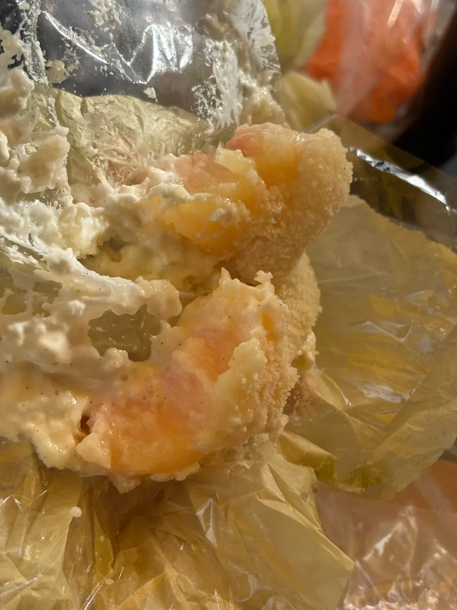 Inside of the mochi showing white peach flesh