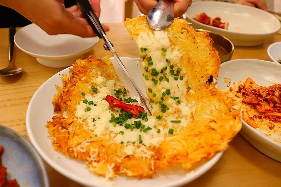 Potato pancake paired with a glass of cheongju