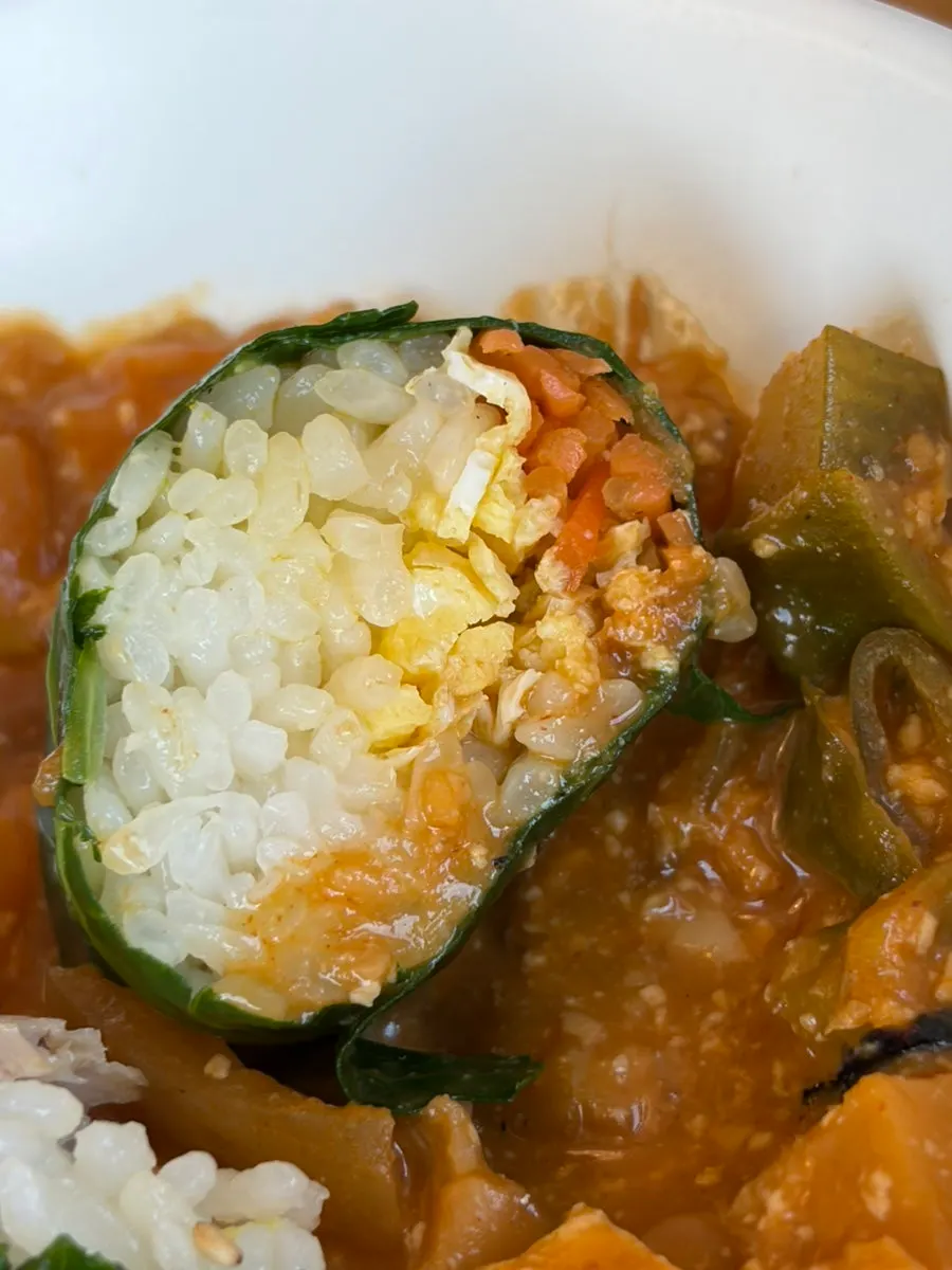 Cross-section of doenjang ssambap with egg strips and carrots