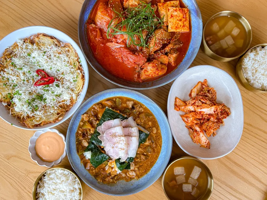 Kimchijjim, kale ssambap, and cheese potato pancake spread