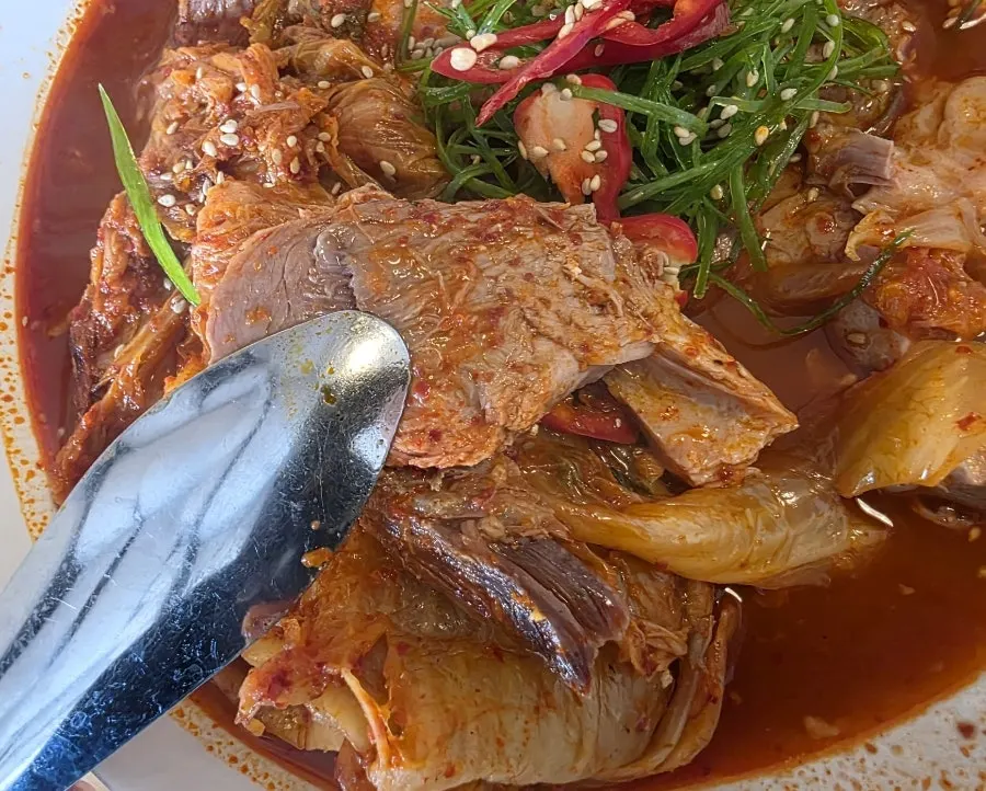 Kimchijjim with half a head of cabbage kimchi, meat, and tofu