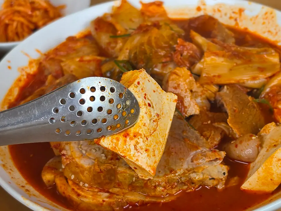 Tofu and pork inside the kimchi jjim