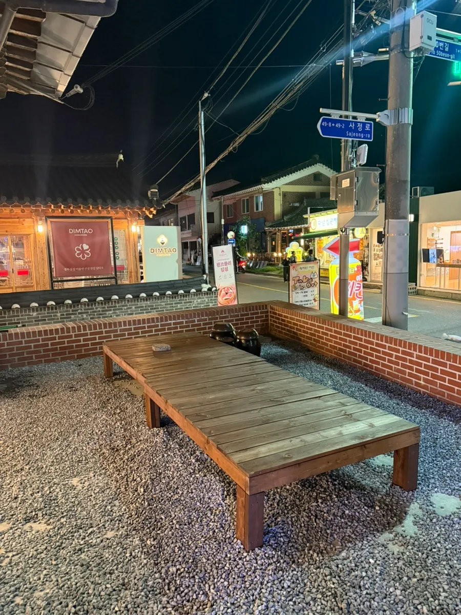Outdoor wooden platform waiting seats at Goyu