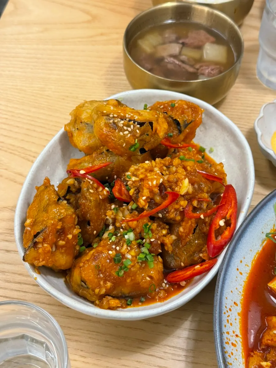 Kimchi and meat piled onto white rice