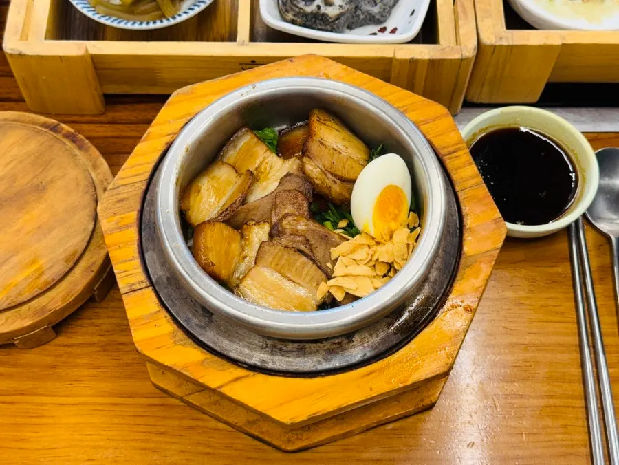 Solbap topped with thick pork belly and a boiled egg