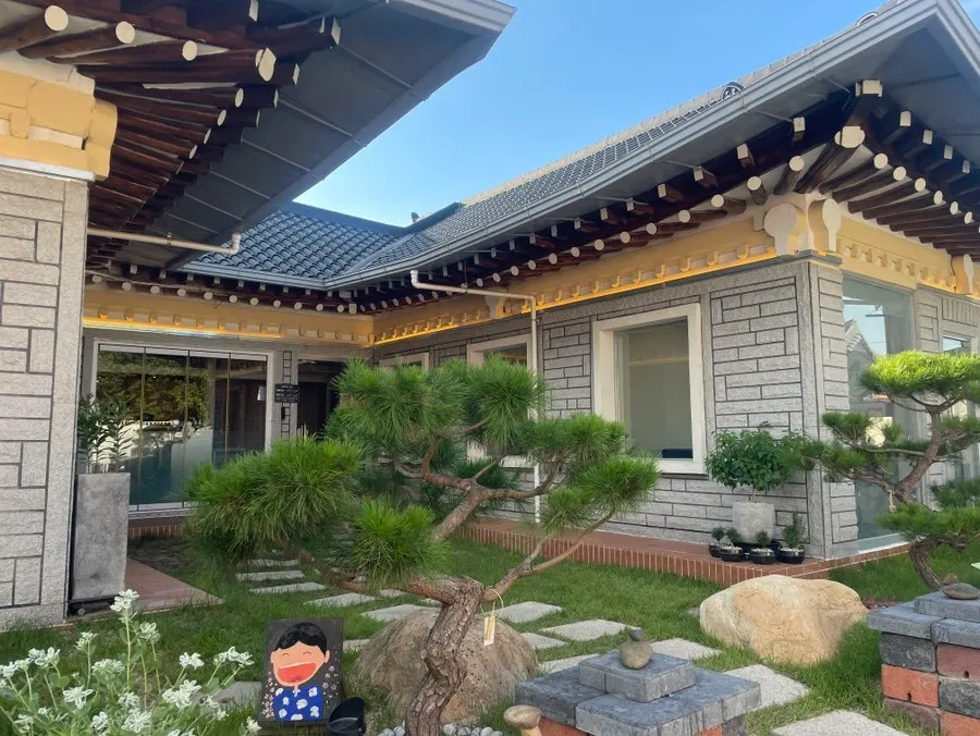 Full view of the Midam Kitchen building with floor-to-ceiling windows