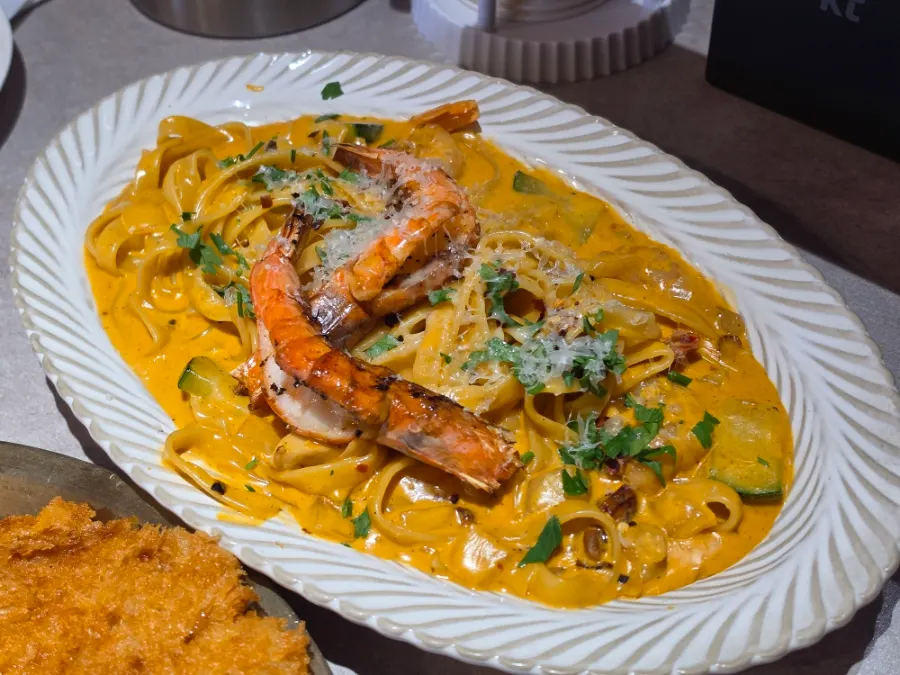 Toowoomba pasta topped with a large shrimp