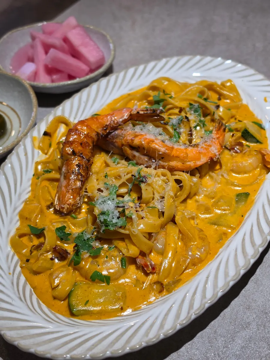 Rosé cream sauce clinging to fettuccine noodles