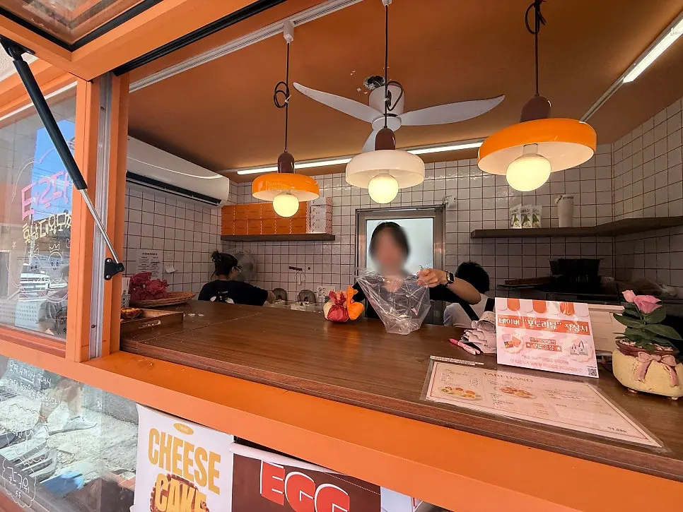 Tareudang's orange storefront, visible from a distance