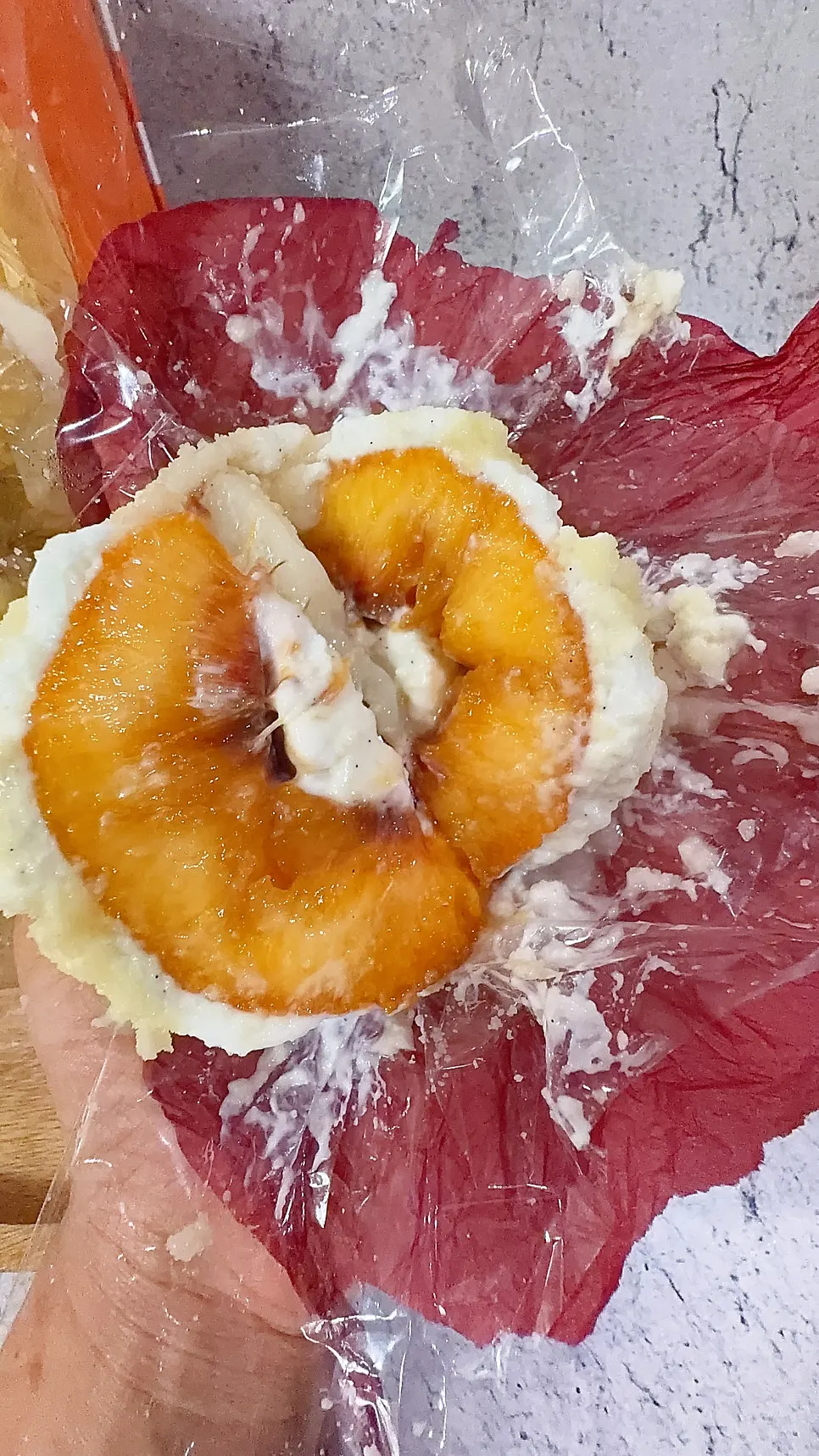 Cross-section of peach yogurt mochi with big peach chunks