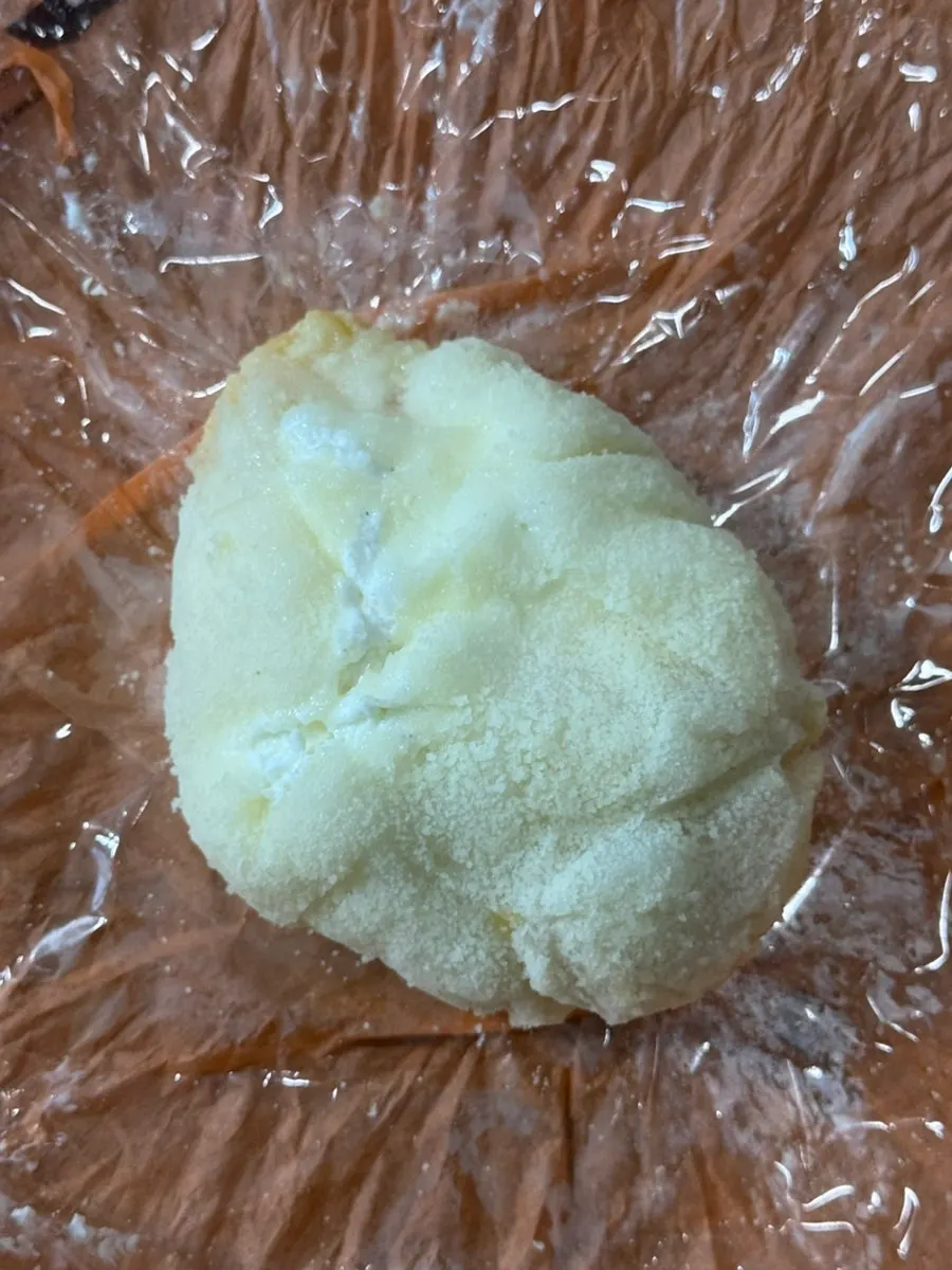 Giant Tareudang mango yogurt mochi held in hand