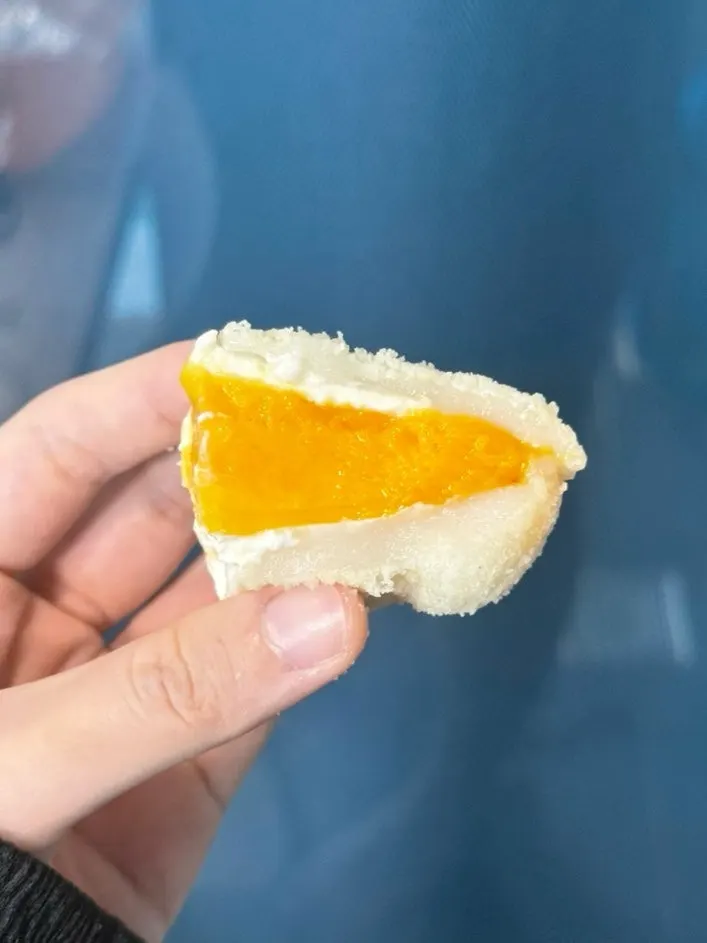 Cross-section of mochi showing mango and yogurt cream