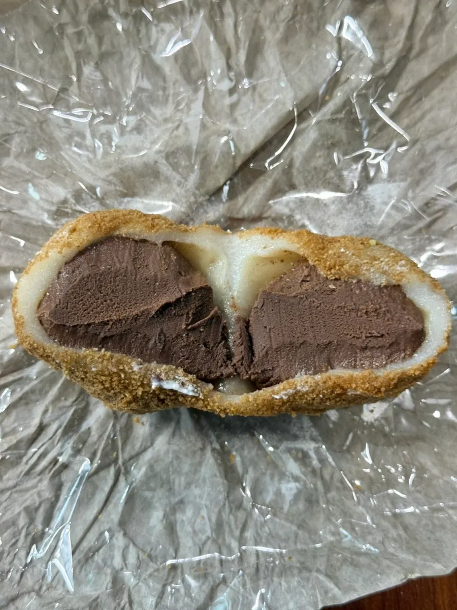 Cross-section of dark chocolate mochi filled with pave chocolate