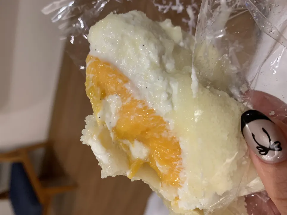 Cross-section of mango yogurt mochi with whole mango inside