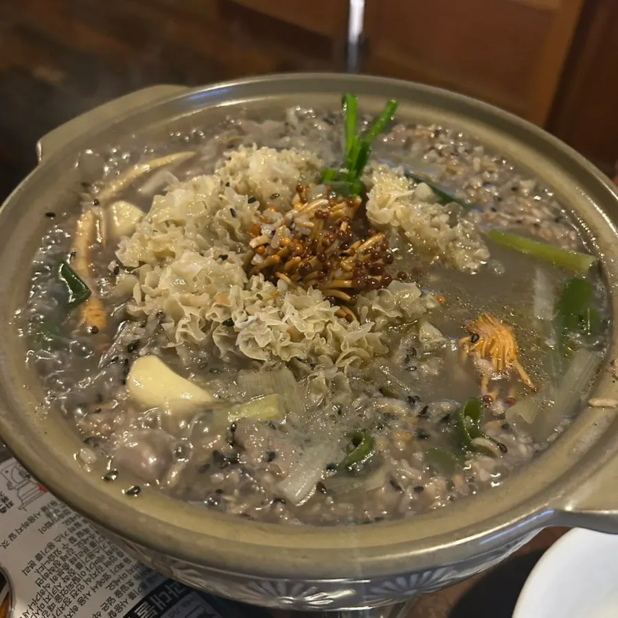 Mushrooms and ginseng in the pot before boiling
