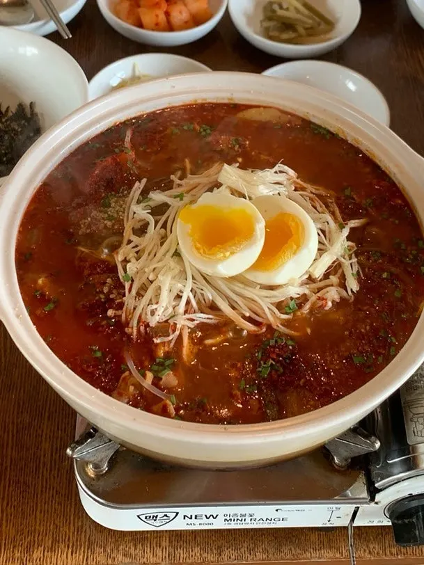 A ladleful of dakbokkeumtang broth