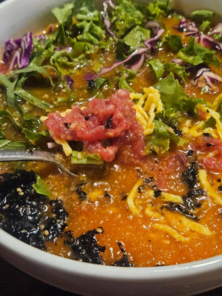 A round scoop of yukhoe served on top